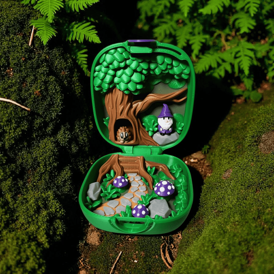 small green case that opens and has a scenery inside with mushrooms, a wizard and a hedgehog