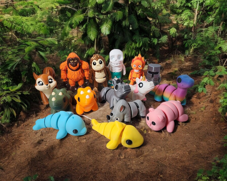 A large collection of animals gathered together with the forest behind them. 