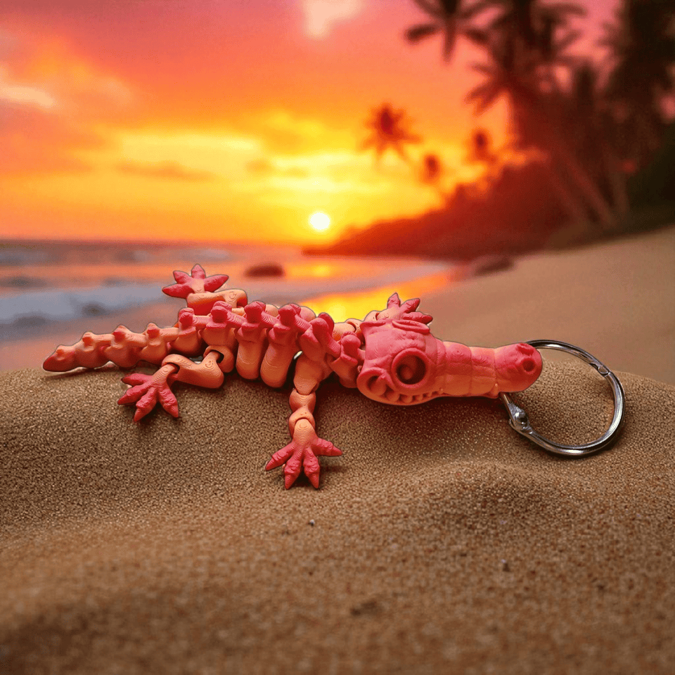 An orange Crocodile laying on a beach with the sunset in the background