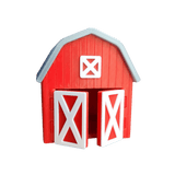 Red toy barn with white doors and details on a transparent background