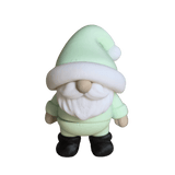 A holiday gnome in a minty green outfit with black boots
